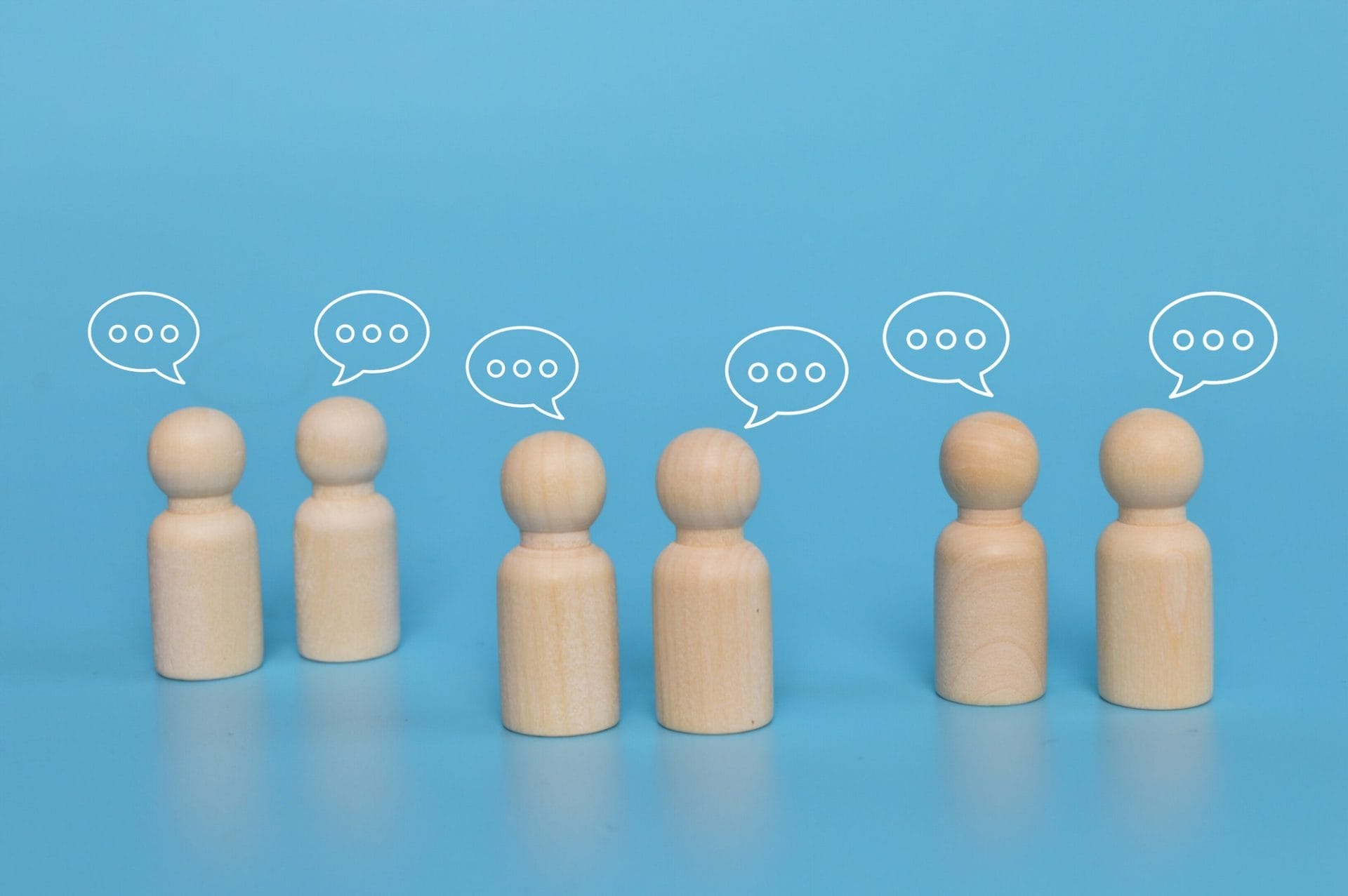 wooden figure with notification icons of message chatting social media interactions